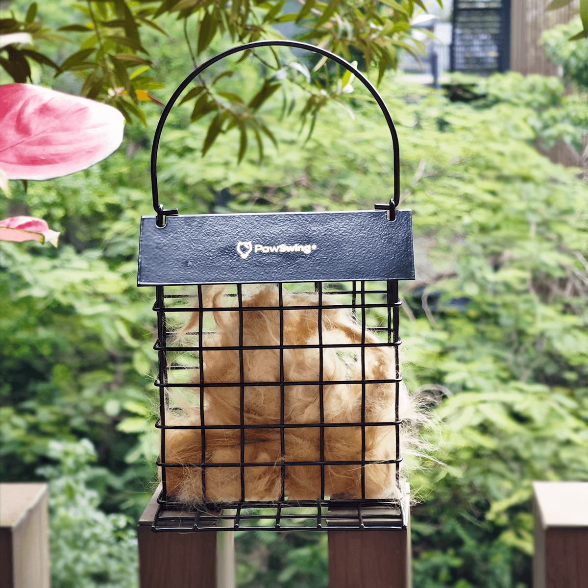 The PawSwing® outdoor cat hair cage mounted in a garden to support local avian nesting efforts