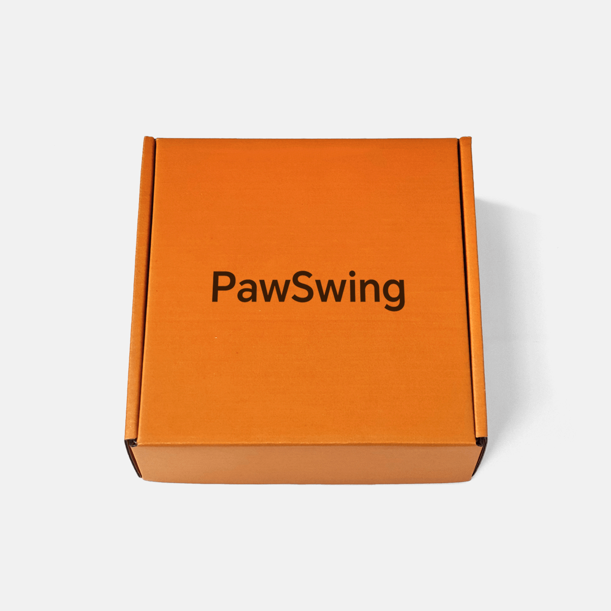 The exterior of the branded orange box used for shipping the PawSwing® cat box mat