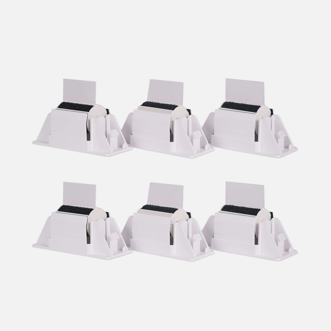 A set of six PawSwing® cat brush modules arranged to show the durable felt grooming surface