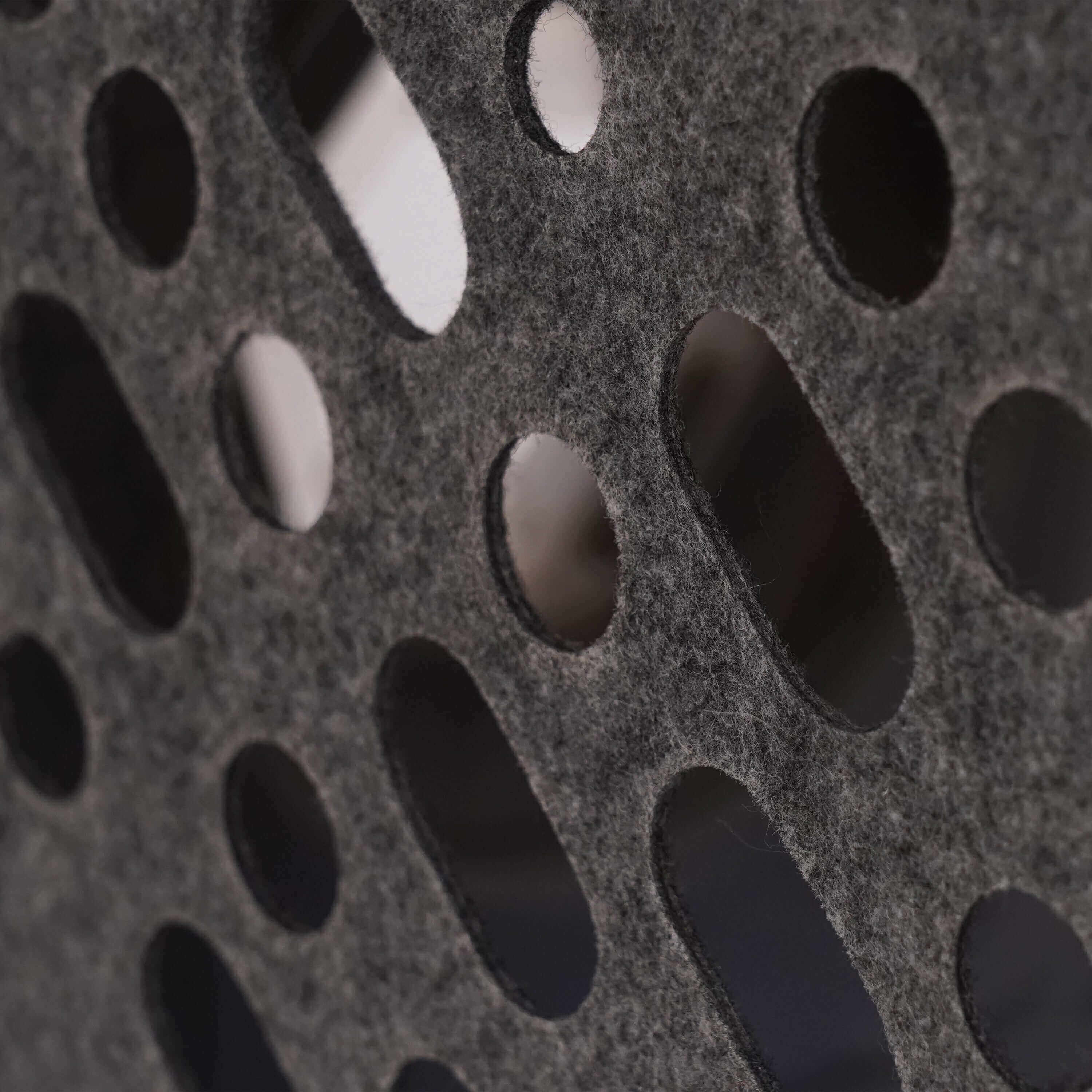 A macro shot of the high-quality, breathable felt material used in the PawSwing self grooming cat house, designed to be both a comfortable hideout and a functional grooming tool.