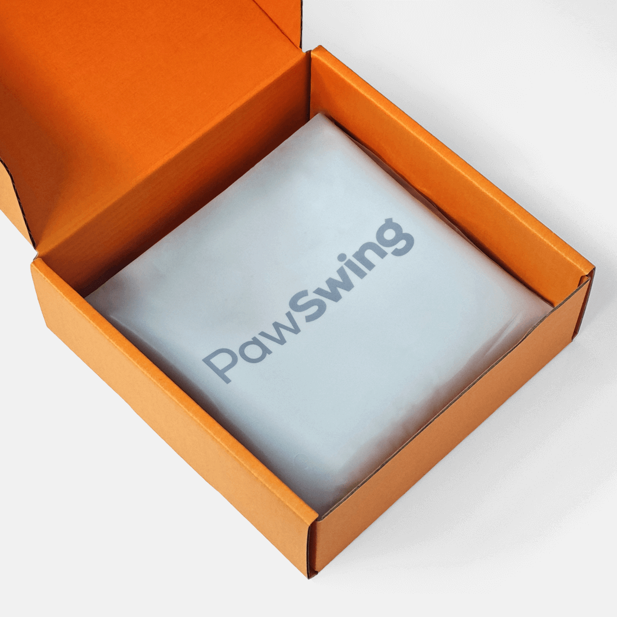 The protective PawSwing® cat box mat packaged securely inside its branded orange delivery box