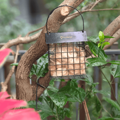 Close-up of a PawSwing® cat hair suet cage, providing natural insulation materials for garden birds