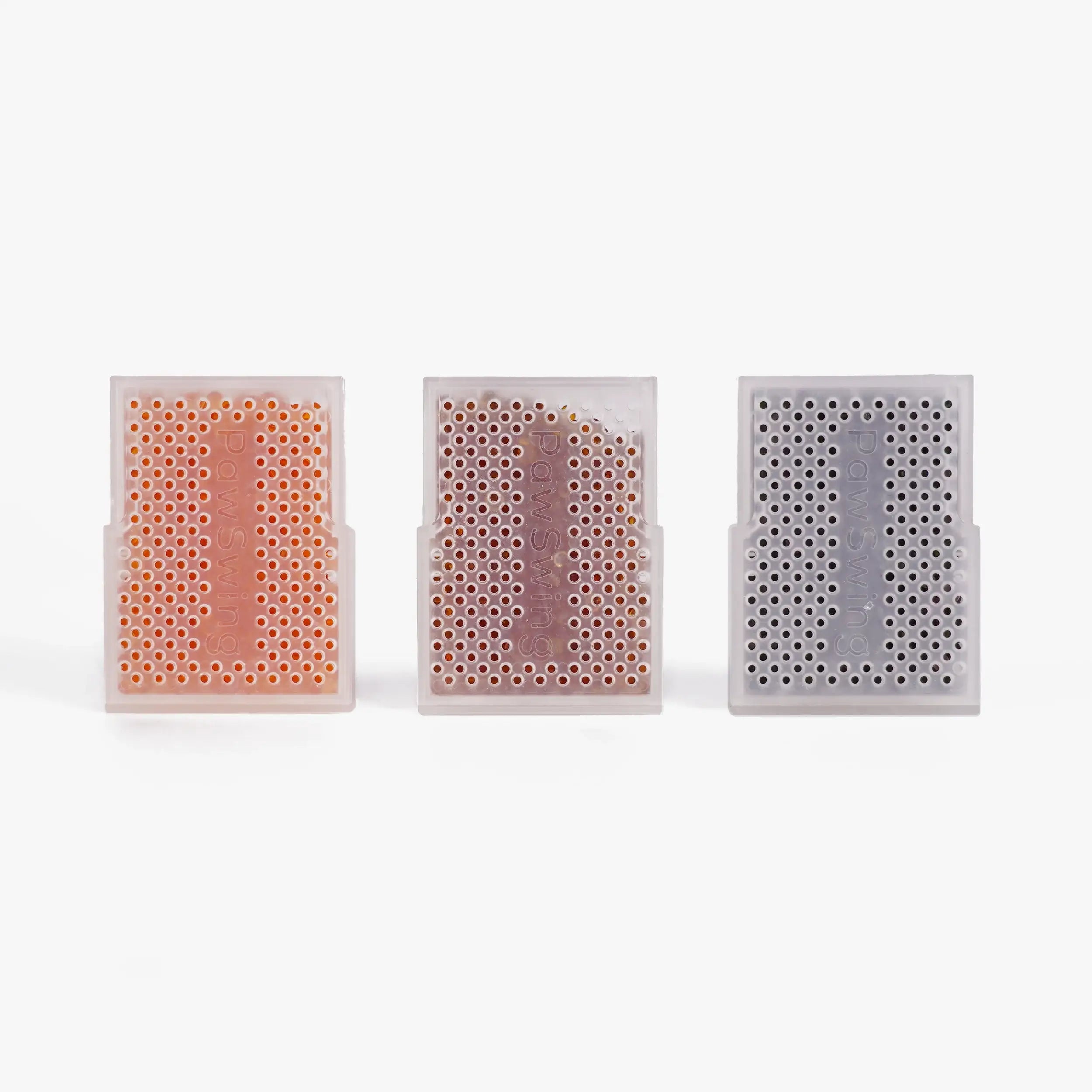 Three stages of color-changing beads within the PawSwing® cat food desiccant for monitoring freshness