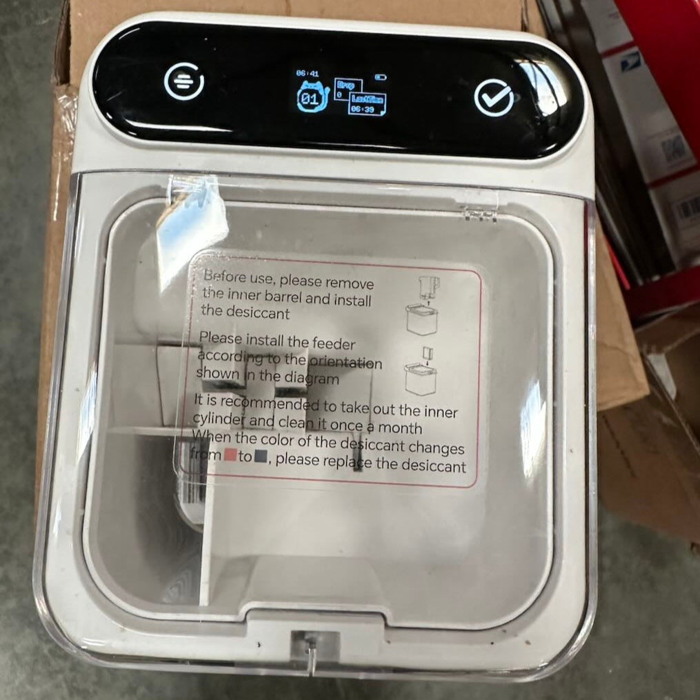 The smart control panel of the PawSwing® treat dispenser, a perfect companion to the best cat brush system for rewarding your cat during their grooming sessions.