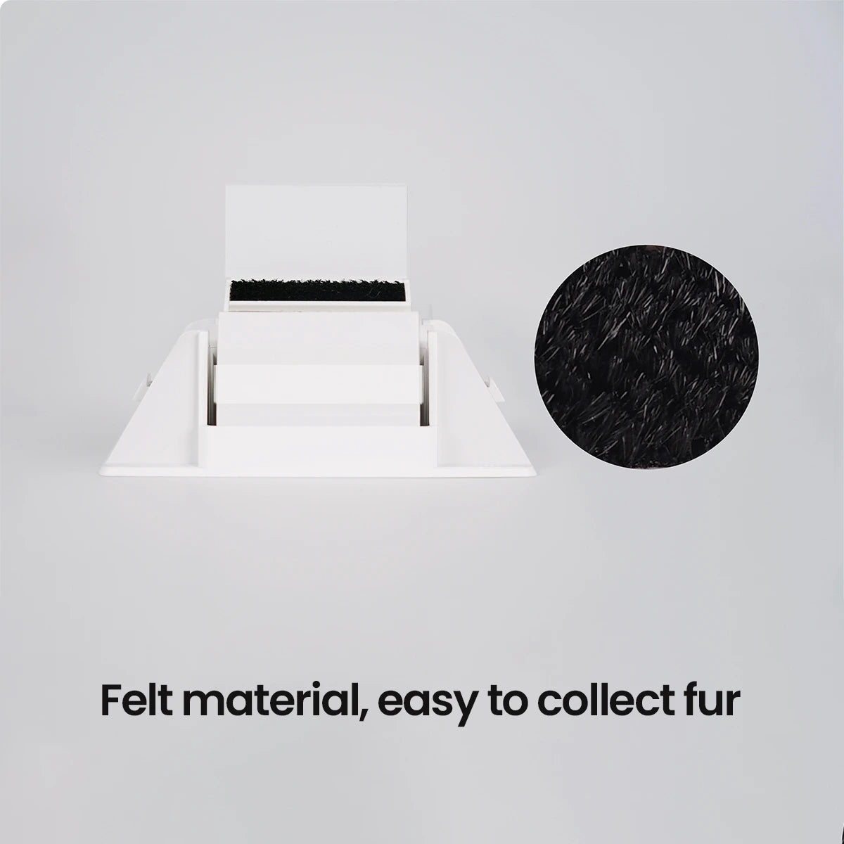 Studio shot of the PawSwing® cat comb module with a callout highlighting the high-quality fur-collecting felt