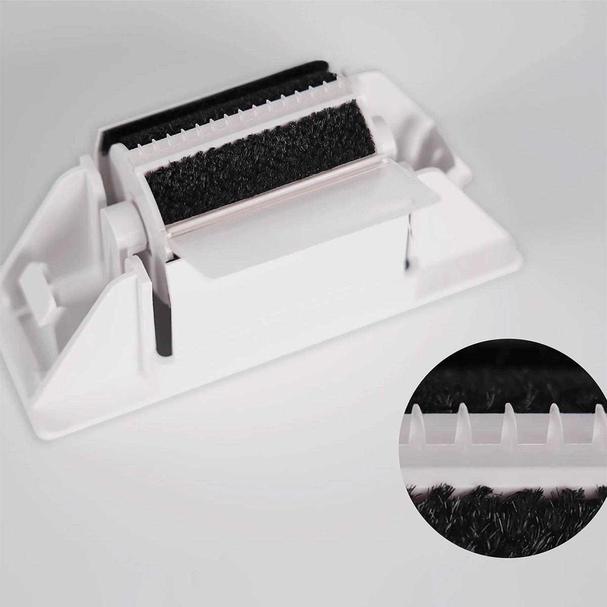 Detailed close-up of the PawSwing® cat self groomer brush module showing the internal teeth and felt layers